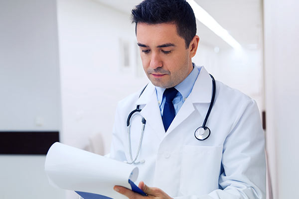 Doctor Reading Charts
