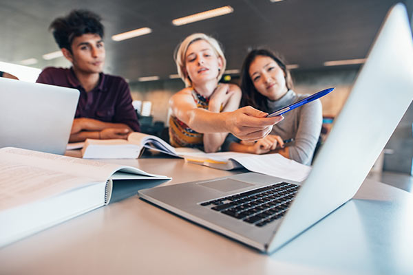 Office Workers Around Laptop