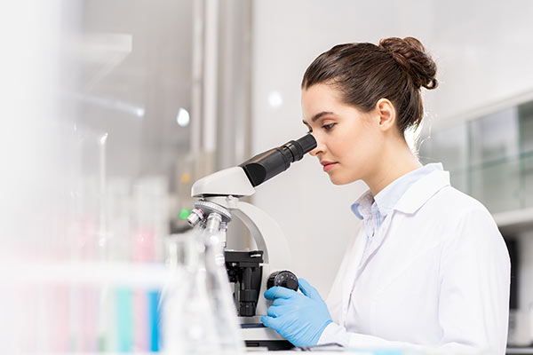Scientest Using Microscope